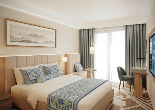 卡萨布兰卡LIVINGSTON GRAND RESORT & SPA的配有一张床和一台平面电视的酒店客房