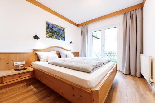 Käserstube Ferienwohnungen客房内的一张或多张床位