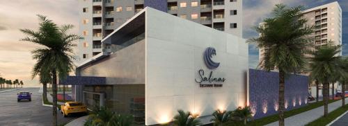 萨利诺波利斯Salinas Exclusive Resort的棕榈树建筑的 ⁇ 染