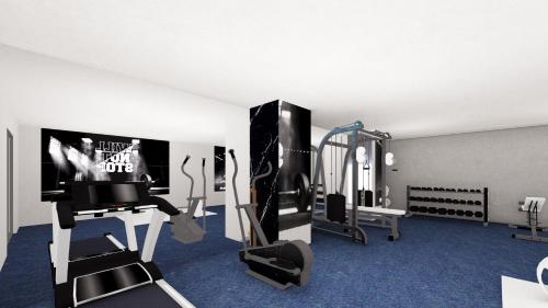 库萨达斯duqqan deluxe hotel的一间带跑步机的健身房