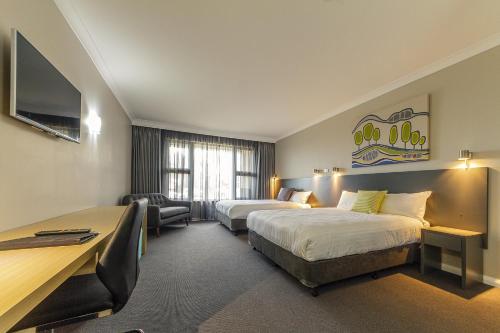 考拉服务俱乐部汽车旅馆客房内的一张或多张床位