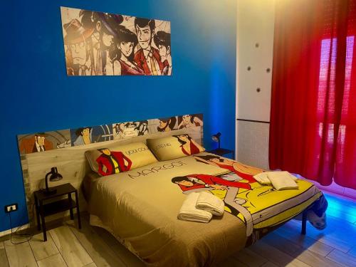 奇维塔韦基亚Be Your Home - Lupen III的一间蓝色客房的卧室,配有一张特大号床
