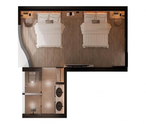 特鲁希略hotel taymi的一间卧室的平面图,设有两张床