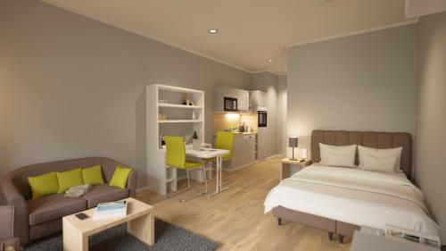 韦茨拉尔Adapt Apartments Wetzlar的一间卧室配有一张床、一张沙发和一张书桌