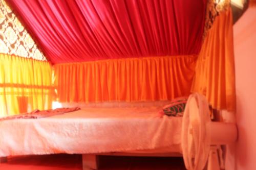 Ramu Green Lake Cottage客房内的一张或多张床位