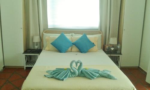 卡里布阿鲁巴精品酒店客房内的一张或多张床位