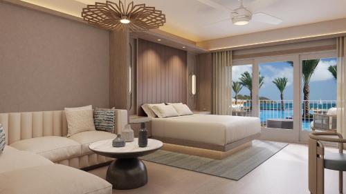 黎明海滩JW Marriott St Maarten Beach Resort & Spa的客厅配有床和沙发