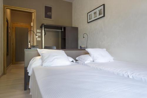 M14 Hotel & Spa客房内的一张或多张床位