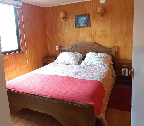 Apartamentos Cadiz -Valdivia客房内的一张或多张床位
