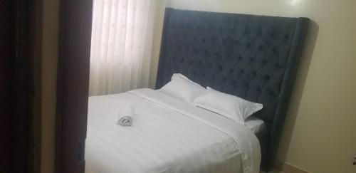 Imani Apartments staycations客房内的一张或多张床位