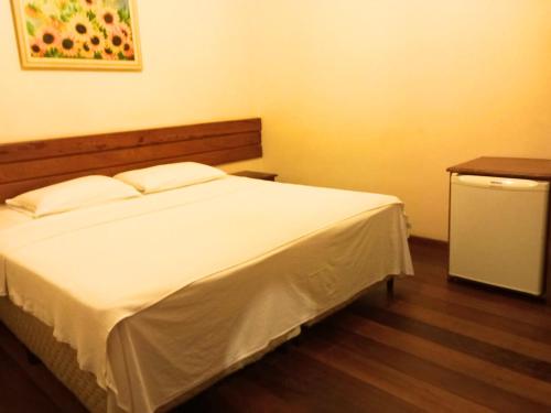 Quarto De Casal Econômico客房内的一张或多张床位
