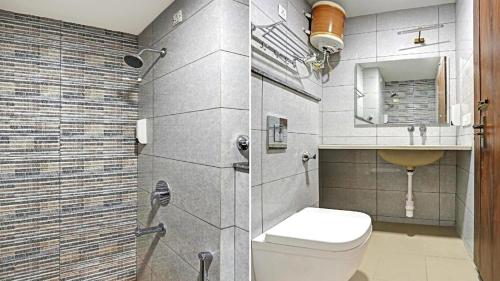 诺伊达Boutique Hotel Blue shine Noida的浴室配有卫生间、盥洗盆和淋浴。