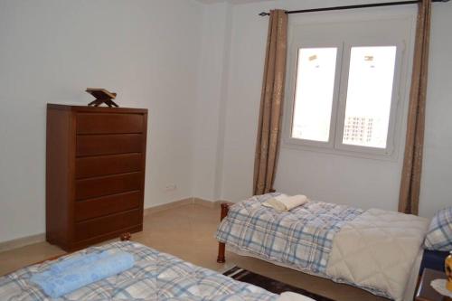 Appartement à Guembetta avec vue panoramique客房内的一张或多张床位