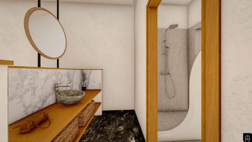 米尔泰SPONGIA HOTEL AND SUITES的一间带水槽和淋浴的浴室