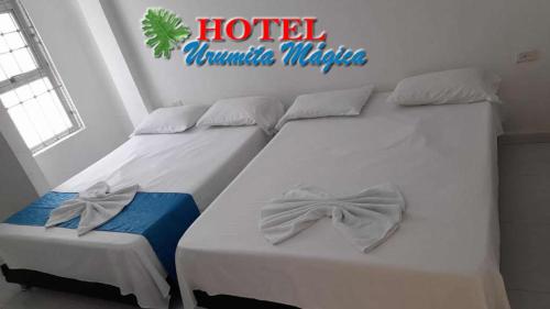 Hotel URUMITA MAGICA客房内的一张或多张床位