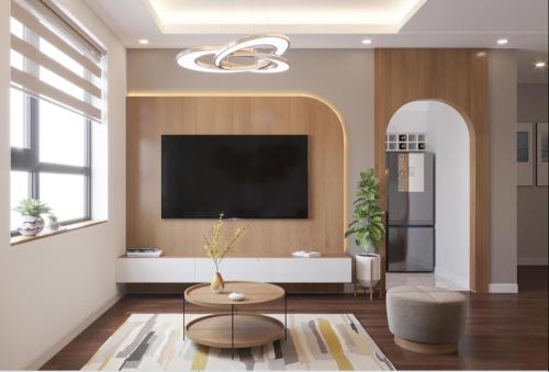 海阳Bach Dang Apartment Hai Duong的客厅设有壁挂式平面电视。