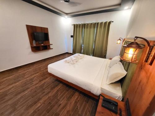 Rashiva Resort客房内的一张或多张床位