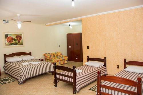 Hotel Fazenda Monte Sião客房内的一张或多张床位