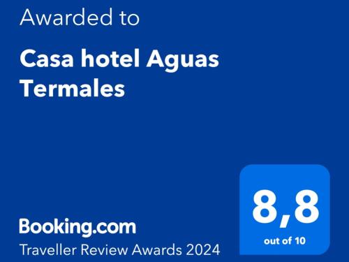 格拉西亚斯Casa hotel Aguas Termales的一部手机的屏幕,上面有一间卡萨酒店