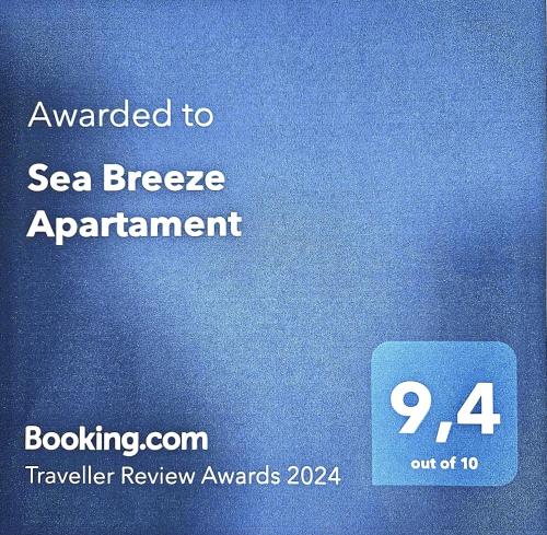 贝尼卡洛Sea Breeze Apartament的一种与海母乳喂养的标记