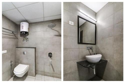 古尔冈RJK Stay - Sohna Road的一间带卫生间、水槽和镜子的浴室