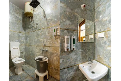 班加罗尔RZ Residency的一间带卫生间和水槽的浴室