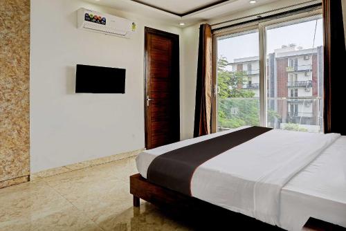 Collection O Vikrant Residency客房内的一张或多张床位