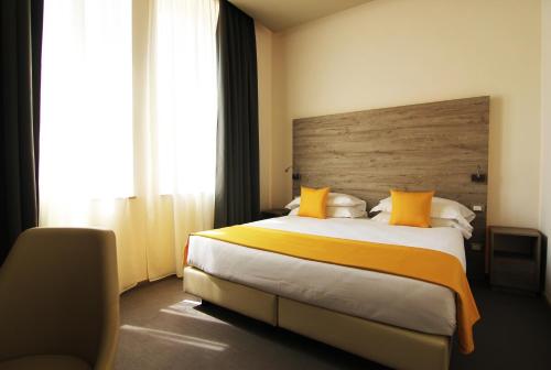 维罗纳太阳酒店客房内的一张或多张床位