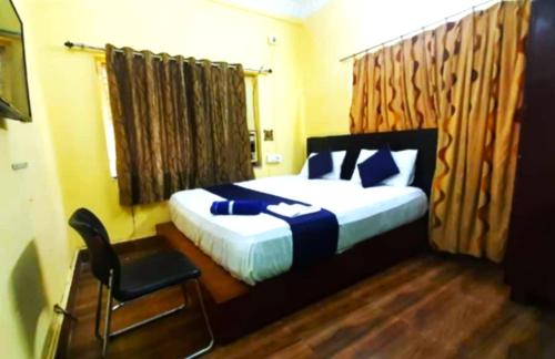 Goroomgo Salt Lake Palace Kolkata - Fully Air Conditioned & Parking Facilities客房内的一张或多张床位