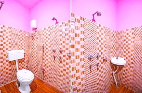 kolkataGoroomgo Salt Lake Palace Kolkata - Fully Air Conditioned & Parking Facilities的一间带卫生间和两个盥洗盆的浴室