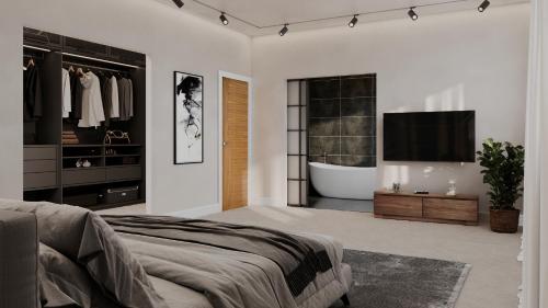 诺丁汉Luxurious New Build的一间带浴缸、电视和床的卧室