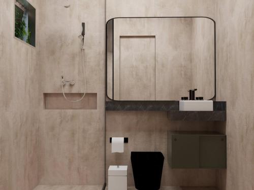 奥林达Duplex的一间带水槽和镜子的浴室