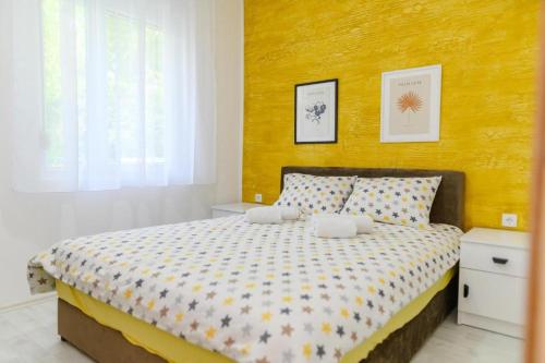 Sunflower Apartmani客房内的一张或多张床位