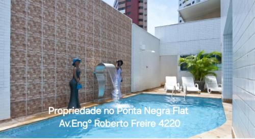 纳塔尔Natal Prime - Porto Imperial的游泳池的 ⁇ 染,游泳池设有喷泉