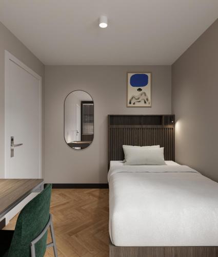 慕尼黑Numa Munich Obersendling的卧室配有白色的床和镜子