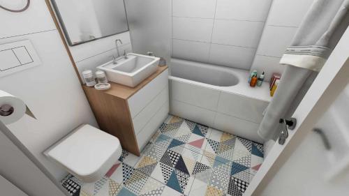 布加勒斯特CozinessApart的小型浴室设有水槽、浴缸和卫生间。