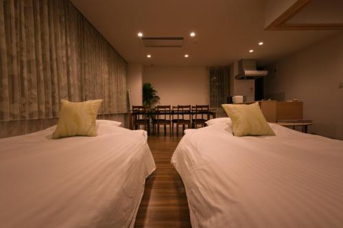 小樽Ryoan / Vacation STAY 80261的带2张床的用餐室
