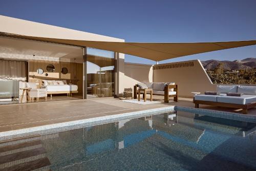 阿基欧斯尼古拉斯圣尼古拉斯湾度假酒店及别墅的一座带游泳池和一间卧室的房子