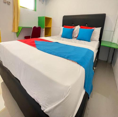 Maluku Residence Syariah客房内的一张或多张床位