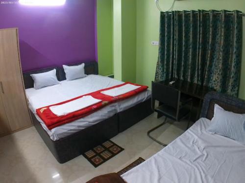 Roop Amrit Guest House , Agartala客房内的一张或多张床位
