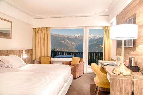 Hotel-Restaurant Le Mont Paisible, Crans-Montana客房内的一张或多张床位