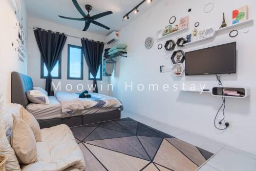 北赖Comfy Studio Room by Moowin的客房设有两张床和一台平面电视。