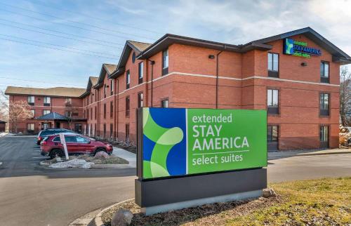 安娜堡Extended Stay America Select Suites - Detroit - Ann Arbor - University South的砖楼前的美国对外住宿标志