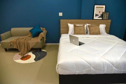 HAKKA Wellness Residence客房内的一张或多张床位