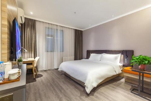 Hanting Premium Hotel Ji'nan Quancheng Road客房内的一张或多张床位