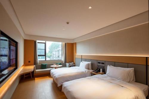 Ji Hotel Guilin Two Rivers And Four Lakes Scenic客房内的一张或多张床位