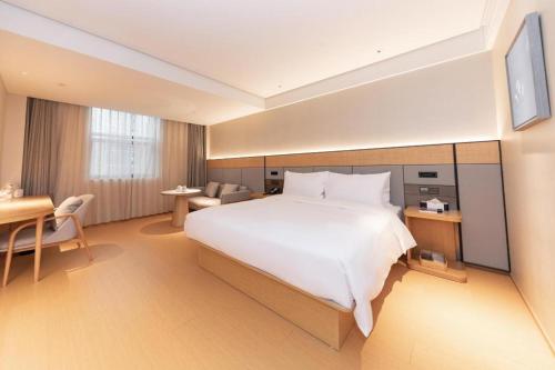 Ji Hotel Nanjing Xianlin Wandamao客房内的一张或多张床位