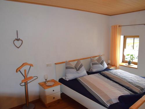 Holiday home in Wilsecker with private terrace的一间卧室设有一张床和一个窗口