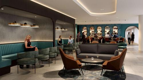 伦敦伦敦假日酒店 - 斯特拉特福市的大堂设有餐厅、椅子和酒吧