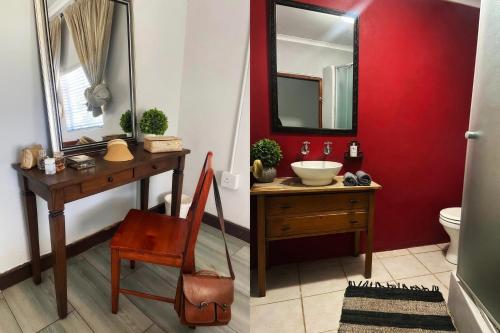 KanoneilandBezalel Wine & Brandy Estate的浴室设有红色的墙壁、水槽和镜子